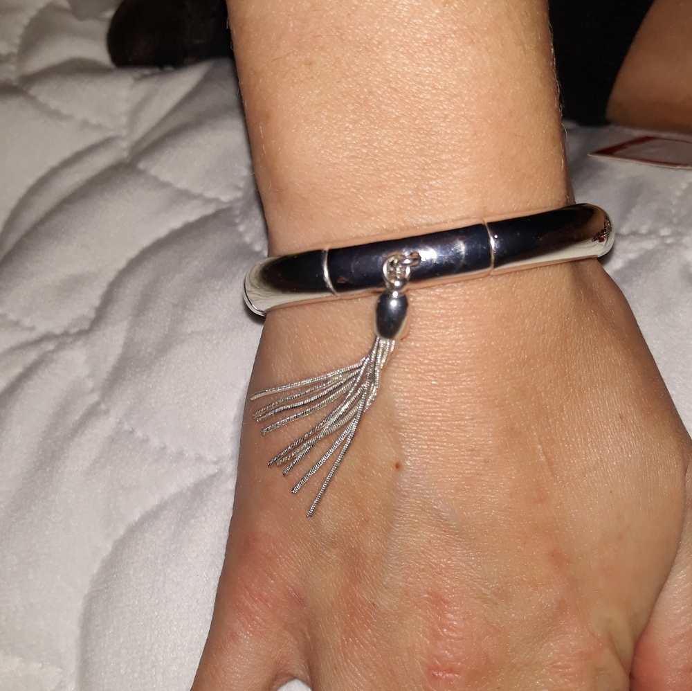 Bangle bracelet with tassel